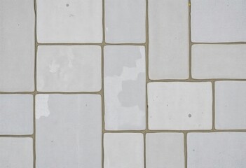Obraz premium Weathered patchwork of gray stone and concrete tiles, vintage texture, backdrop, retro