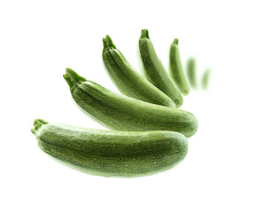 Green zucchini levitate on a white background