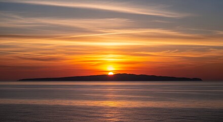 Fototapeta premium Vibrant Golden Sunset Over Ocean Horizon with Silhouetted Island and Contrail Clouds