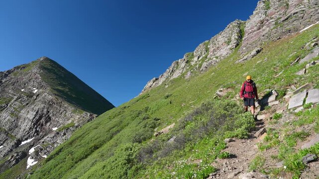 Hiker Walking Down Hill on Phantom Terrace, Venable Comanche Loop Hiking Trail in Sangre De Cristo Mountains, Colorado USA