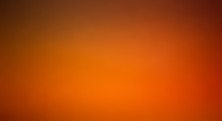 Abstract vibrant gradient featuring warm hues of orange, brown and red seamlessly blending