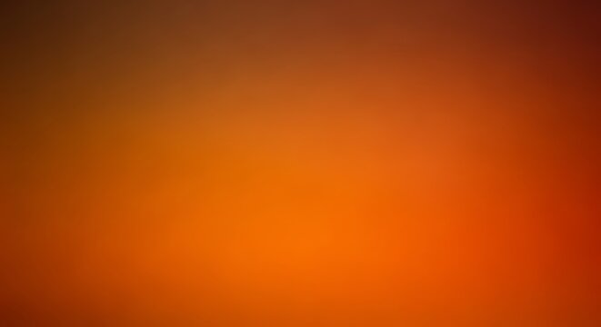 Abstract vibrant gradient featuring warm hues of orange, brown and red seamlessly blending