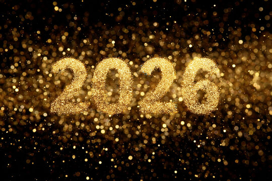 A blurry image of the number 2026 in gold letters