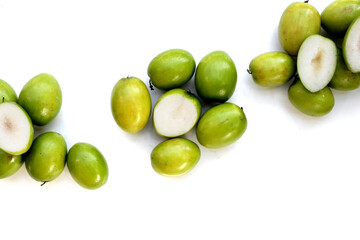 Green jujube fruits on white background.
