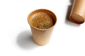 Brown paper cup of black coffee on a white background