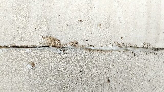 Lightweight concrete block wall with untidy mortar joints