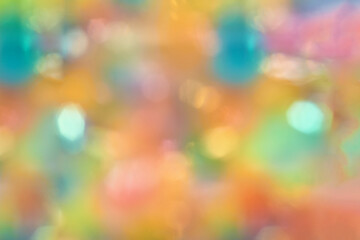 Colorful abstract background with blurred bokeh lights in vibrant multicolor palette.