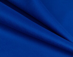 Fototapeta premium Deep blue fabric elegantly draped, showcasing texture and soft folds