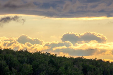 South Ural, Ural mountains in summer. Sunset in the mountains. The top of the mountain range. Summer day.