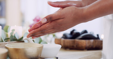 Hands, oil and wellness with masseuse in spa, getting ready for session or treatment closeup. Healing, massage and physical therapy with person in salon for relax, stress relief or wellbeing