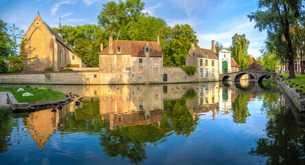 The church, houses, gate and bridge of the medieval Beguinage in the old city of (Brugge), East Flanders, Belgium