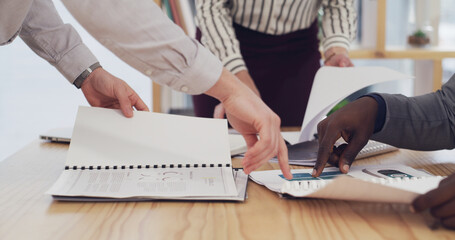 Office, meeting and hands of business people with documents for planning finance review or strategy. Corporate, pointing and team of workers with paperwork, research and financial report for proposal