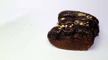 Chocolate Biscuit with Nut Topping on White Background