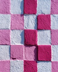 Checkered pattern of painted squares in pink and white