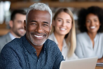 Fototapeta premium Smiling senior businessman leading diverse team meeting