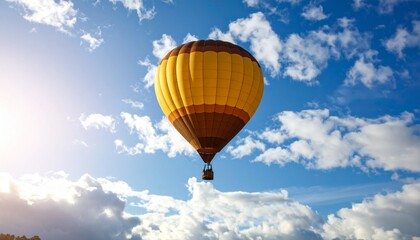 Naklejka premium Majestic hot air balloon floating peacefully in a beautiful blue sky with fluffy clouds