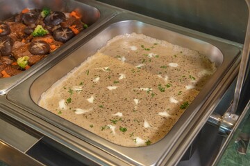 Buffet tray of creamy mushroom soup
