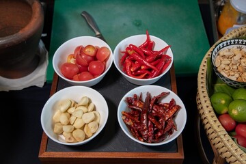 Fresh Thai Ingredients with Chilies, Garlic, and Tomatoes
