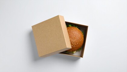 Eco-friendly takeaway food packaging Mockup with a burger inside a craft paper box, isolated on a white background.