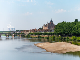 View on cooling towers of nuclear power plant thermal power station in which heat source is nuclear reactor, France, Europe, cheap energy source, Gien on Loire river