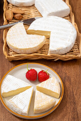 French soft cheeses collection, creamy cow's milk cheese le paysan and brie with white mold, France