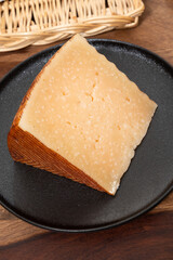 Very old anejo tostado Spanish hard cheese, cow and sheep curado, manchego, goat cheese close up