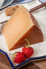 Very old anejo tostado Spanish hard cheese, cow and sheep curado, manchego, goat cheese close up