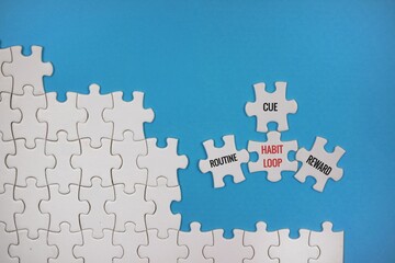 The Habit Loop Concept Is Illustrated With Puzzle Pieces That Say 'Cue, Routine, Reward' On A blue...