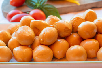 Cheese collection, smoked yellow italian mini scamorza or scamorzella cheese