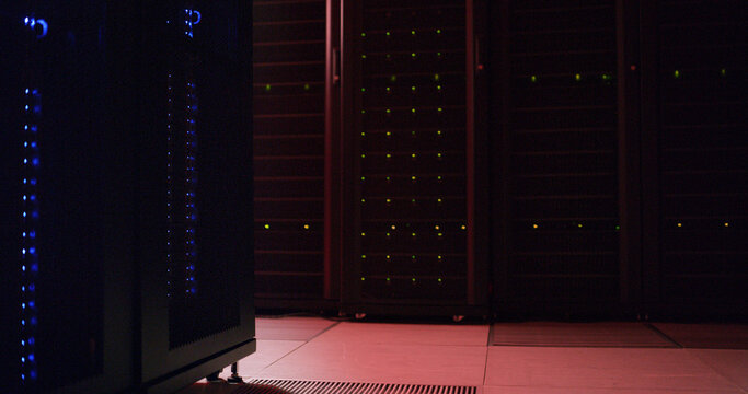 Empty server room, information technology and lights with connectivity for hardware, storage and IOT. Dark interior, big data center and hub for cybersecurity, network operations and software systems