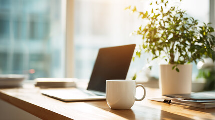 Modern office workspace with laptop, coffee cup, and houseplant on a wooden desk, sunlight from window, clean composition, realistic stock style