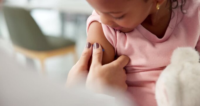 Hands, doctor and plaster on child at hospital for first aid, injection and virus vaccination. Pediatrician, helping and kid with bandage for medical checkup, immunization shot and wound protection