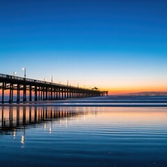 Picturesque view of a pier stretching into the ocean during sunset hour