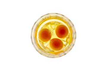 Three Raw Eggs in a Glass Bowl Top View Isolated on White