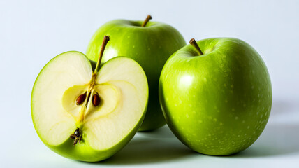 Vibrant green apples one sliced showing seeds and core sliced apple whole apples