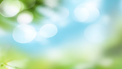 Obraz premium Blurry, vibrant green and light blue bokeh background with out-of-focus leaves