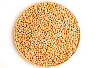 Soybeans in wooden dish on white background