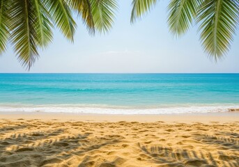 Beautiful tropical beach with palm tree leaves framing the shot and clear blue ocean water on a sunny day