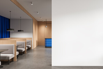 Modern cafe interior with wooden booths and blank white wall for poster mockup or design presentation template layout concept. 3D Rendering