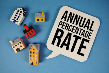 Adjustable Rate Mortgage text with house models on blue background