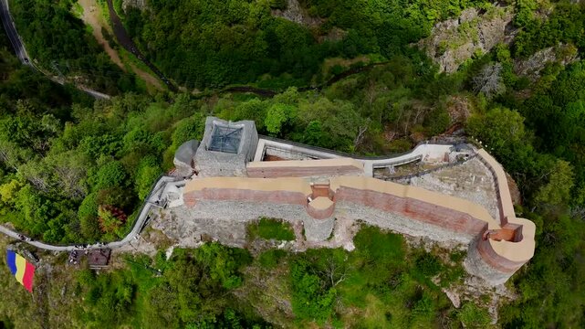 Aerial footage of the Poenari Castle (Cetatea Poenari), situated on top of a mountain in Romania