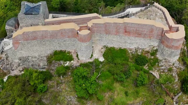 Ascending drone footage of the historic Poenari Castle, situated on top of a mountain in Romania