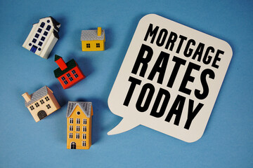 Mortgage Rates Today text with house models on blue background