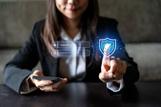 Young businesswoman using smart devices with global network connection and cybersecurity personal data protection technology