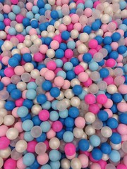 Vibrant and colorful plastic balls in a ball pit, full frame background