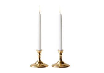 Two gold candle holders with white candles