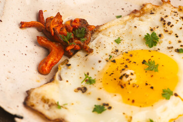 Fried Cordyceps Mushrooms with Sunny Side Up Egg on Handmade Ceramic Plate
