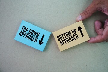 Paper with two words top down approach and bottom up approach. two distinct methods used in various fields, including project management, decision-making, and even reading.