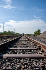 Fototapeta premium a boy walking on railway