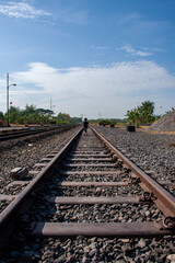 Obraz premium a boy walking on railway
